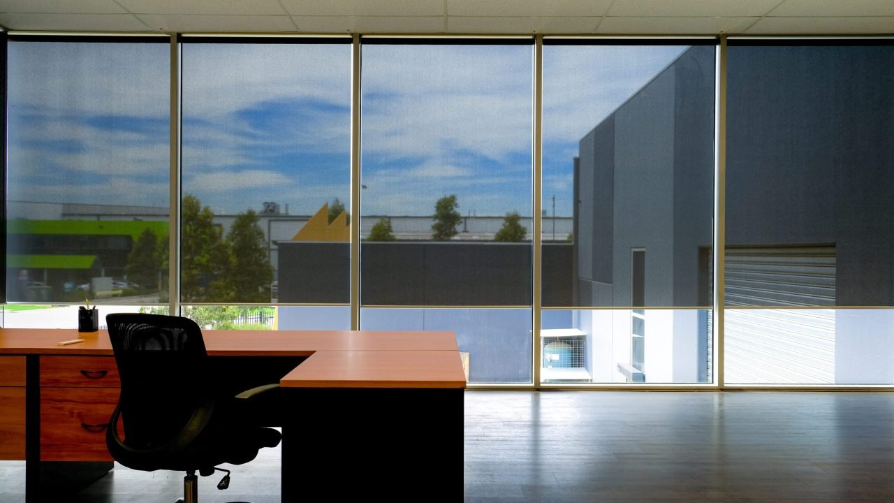 The automated roller blinds in modern office