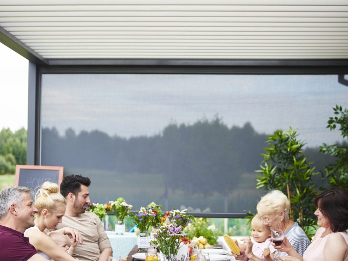 Three generation family having family lunch on patio